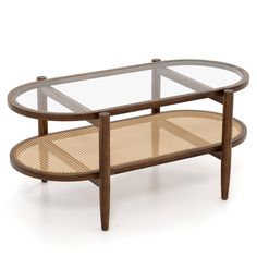 an oval coffee table with glass top and wicker shelf on the bottom, against a white background