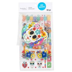 a package of stickers with skulls, flowers and hearts on the front of it