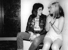 black and white photograph of two women sitting next to each other