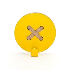 a yellow object with two crossed sticks on it's side, sitting in front of a white background