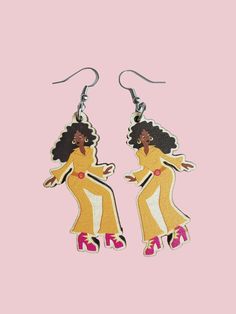 A gorgeous pair of retro 70s inspired disco diva wooden earrings. Light wood with black haired diva wearing an orange jumpsuit. This would make such a lovely gift! charm Measures 51mm x 26mm . These printed wooden charms are made from responsibly sourced, fast-growing woods on 4mm thick Maple MDF. The earring hooks are silver plated. Please check out my other pin badge designs and matching earrings / necklaces! 70s Hair Disco Jewelry, Disco Dancing, Disco Diva, 60s Jewelry, Orange Jumpsuit, Disco Dance, Northern Soul, Badge Design, 70s Retro