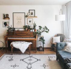 a living room filled with furniture and a piano