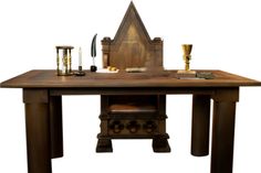 a wooden table topped with an old fashioned stove