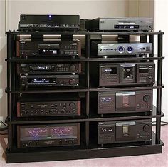 there are many stereos stacked on top of each other