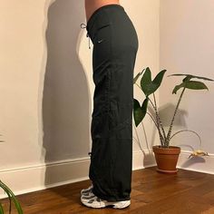 Deadstock Vintage Nike joggers / parachute pants in dark green . Come brand new with tags on. Size: Medium / UK12 (modelled size) Model is typically uk8 but wearing a 12 for a more loose/oversized fit - have drawstrings on waist to fit smaller sizes xx Instant buy is on! Available ✅ Instant buy is on! Measurements: Inside leg 31.5" Model is 5'6 and is typically size UK8  We ship internationally: message us for international postage prices before purchasing.  Items are dispatched next day (mon - sat).  Vintage Deadstock condition with tags still on.       Nike tracksuit bottoms  Nike cargos Sporty Wide Leg Sweatpants For Outdoor, Sporty Wide-leg Sweatpants For Outdoor, Wide Leg Sporty Sweatpants For Outdoor, Green Cargo Pocket Joggers For Outdoor, Sporty Cargo Style Sweatpants With Straight Leg, Sporty Cargo Style Straight Leg Sweatpants, Sports Parachute Pants With Drawstring, Sporty Cargo Pants With Drawstring, Green Athleisure Cargo Pants For Sports