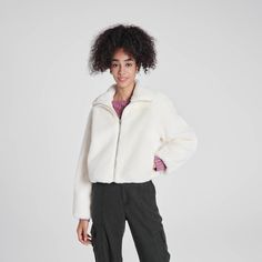 Stay stylish this fall and winter with our zip-front faux fur jacket. Featuring a stand-up collar and a cozy fuzzy texture, this loose-fit jacket ensures comfort. Side pockets add practicality, while elastic bands at the hem and sleeve cuffs create a stylish bubble effect. Available in classic black, cream, and trendy leopard print, it’s the perfect blend of fashion and function. Wild Fable™: A look for every story Faux Leather Biker Jacket, Knitting Women Cardigan, Target Clothes, Boat Neck Tops, Workout Jacket, Faux Fur Jacket, Knitting Women, Fur Jacket, Women Long Sleeve