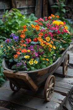 an old wheelbarrow filled with colorful flowers