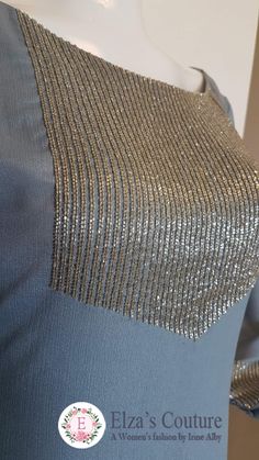 the back of a dress with sequins on it and silver fabric, as well as