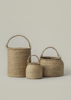 two woven baskets sitting next to each other