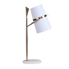 a floor lamp with a white shade on the top and a gold metal base, in front of a white background