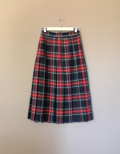 "Authentic vintage pleated plaid skirt. High waisted and longer in length. Waistband has elastic on each side for added comfort. Button and zipper closure in back. Skirt is in excellent, like new, clean condition with very little to no signs of previous wear. Measurements (taken zipped or buttoned up and laid comfortably flat) x2 inches Willow Ridge Tag Size 6P Made in USA Waist 25\"-27\" Hips 38\" Length 31\" All items are free of rips, tears, holes, and stains. Vintage items are subject to sig Fall Pleated School Uniform Bottoms, Fall School Uniform Style Pleated Bottoms, Fall School Uniform Lined Skirt, Fall School Uniform Pleated Bottoms, Pleated School Uniform Bottoms For Fall, School Uniform Style Lined Skirt For Fall, Fall School Uniform Style Pleated Skirt, School Uniform Style Pleated Skirt For Fall, Pleated Bottoms For School In Fall