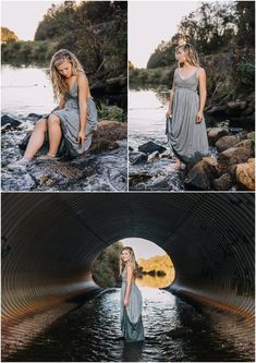 a woman in grey dress sitting on rocks near water and looking at the camera with her legs crossed