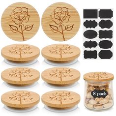 six wooden coasters with flowers on them and eight black circles around the top one is filled with almonds