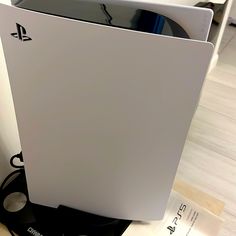 the back side of a white playstation gaming console