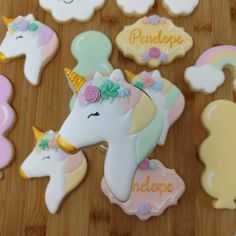 decorated cookies are arranged on a wooden table