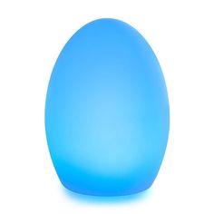 an egg shaped blue object sitting on top of a white surface with one light on it's side