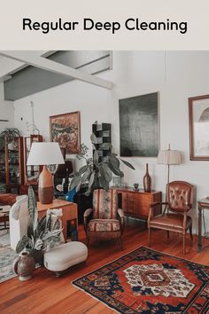 a living room filled with lots of furniture and plants on top of a hard wood floor