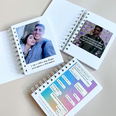 two spiral bound notebooks with photos on them