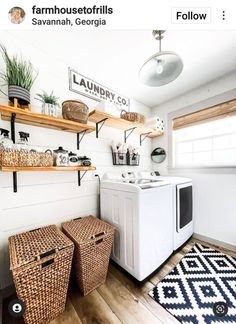 a washer and dryer in a laundry room with baskets on the shelves next to them