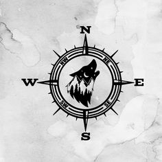 a black and white drawing of a wolf on a compass with the words w e s