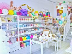 a room filled with lots of balloons and decorations