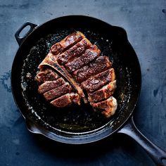 steak in a skillet on a table