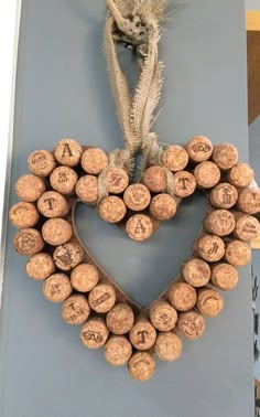 a heart shaped wreath made out of wine corks