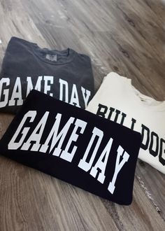 Show your spirit for your favorite team with this customized game-day cropped tee! This tee can be personalized with your team name/city or you can opt for the traditional game day designs. Comfort Colors tee- women's sizing. 100% ring-spun cotton Game Day Fan Apparel Top With Lettering, Fan Apparel Tops With Lettering For Game Day, Collegiate Tops With Lettering For Game Day, Team Spirit Tops With Lettering For Game Day, Varsity T-shirt With Lettering For Game Day, Varsity Lettering T-shirt For Game Day, Varsity Fan Gear T-shirt With Lettering, Varsity Style Fan Gear T-shirt With Lettering, Varsity Lettering T-shirt For Fan Gear