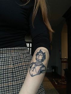 a woman with a tattoo on her arm