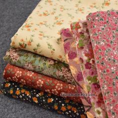 four different fabrics stacked on top of each other