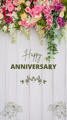 an anniversary card with flowers and greenery