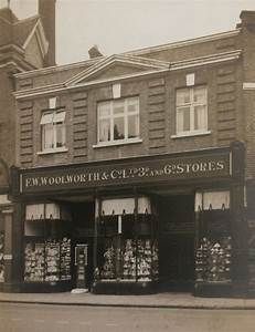 an old black and white photo of a store front