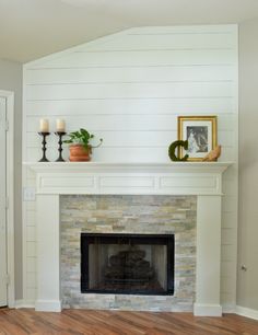 fireplace makeover with white paint and wood floors