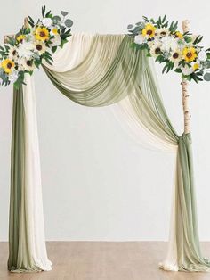 an arch decorated with sunflowers and greenery for a wedding or ceremony decoration