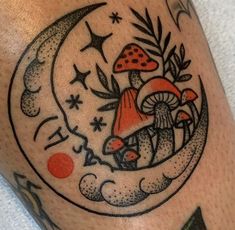 a tattoo with mushrooms and stars on it