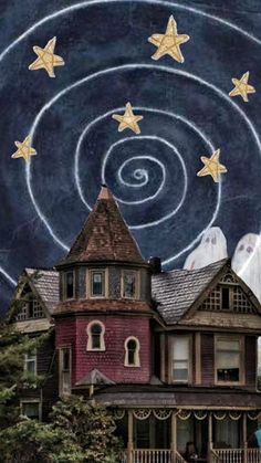 an old house with stars painted on the roof and in the background is a spiral