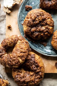 chocolate chip cookies on a plate with one cookie in the middle