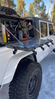 an off road vehicle parked in the snow