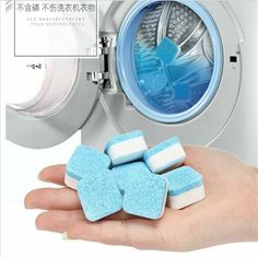 blue and white marshmallows sitting in front of a washing machine