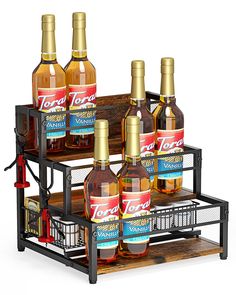 six bottles of various types of alcohol on a wooden shelf with wire baskets and metal handles