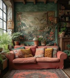 a living room filled with lots of furniture and plants