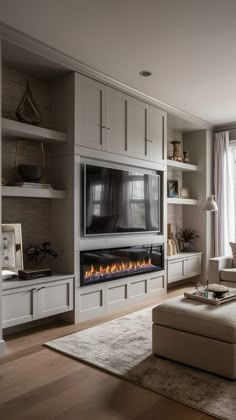 a living room filled with furniture and a flat screen tv mounted to the side of a wall