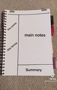 a notebook with the words main notes written in red and black on top of it