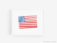 an american flag painted in red, white and blue watercolors is displayed on a wall