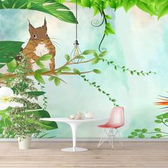 a room with a table, chair and wall mural in the shape of animals on trees