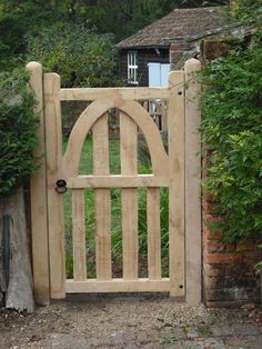 a wooden gate with an arched top