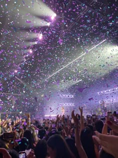 confetti falling from the ceiling at a concert