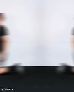 blurry image of two men in black shirts