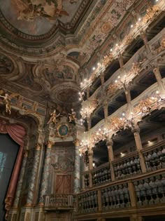 an ornately decorated auditorium with chandeliers