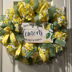 a yellow and green wreath with the words lemons on it